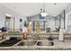 Functional kitchen overlooking the living room featuring a stainless steel sink and generous counter space at 627 Waterway Village Dr. # 8-I, Myrtle Beach, SC 29579