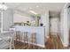 Inviting kitchen with breakfast bar provides seating and a seamless transition to the entryway and dining space at 627 Waterway Village Dr. # 8-I, Myrtle Beach, SC 29579