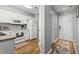 Efficient white kitchen featuring wood flooring, plenty of cabinet space, and white appliances at 627 Waterway Village Dr. # 8-I, Myrtle Beach, SC 29579