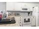Well-equipped kitchen features white appliances, sink, and ample counter space at 627 Waterway Village Dr. # 8-I, Myrtle Beach, SC 29579