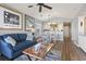 Comfortable living room with blue sofa and dining area, adjacent to kitchen at 627 Waterway Village Dr. # 8-I, Myrtle Beach, SC 29579