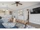 Bright living room with wood floors, ceiling fan, comfortable couch and passthrough to the kitchen at 627 Waterway Village Dr. # 8-I, Myrtle Beach, SC 29579