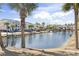 Scenic view of community pond with fountain surrounded by palm trees and buildings at 627 Waterway Village Dr. # 8-I, Myrtle Beach, SC 29579