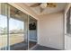 Covered porch with ceiling fan overlooking the yard through sliding glass doors at 627 Waterway Village Dr. # 8-I, Myrtle Beach, SC 29579