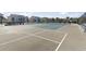 Exterior shot of community tennis courts with chairs and a view of nearby apartments at 627 Waterway Village Dr. # 8-I, Myrtle Beach, SC 29579