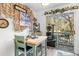 A cozy dining space with walkout to outdoor patio that features a multi-tiered cat tower at 6702 Jefferson Pl. # B6, Myrtle Beach, SC 29572
