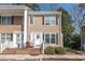 A charming home featuring a welcoming porch and neat landscaping with a decorative wreath on the front door at 6702 Jefferson Pl. # B6, Myrtle Beach, SC 29572