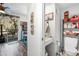 Bright hallway featuring an eclectic mix of decor, leading to the bathroom and kitchen at 6702 Jefferson Pl. # B6, Myrtle Beach, SC 29572