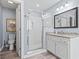 Bathroom with glass enclosed shower, white cabinet sink, granite countertops, and a toilet at 720 Dove Haven Ln., Myrtle Beach, SC 29579