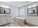 A spacious bathroom featuring dual vanities, a soaking tub, and modern fixtures at 720 Dove Haven Ln., Myrtle Beach, SC 29579