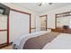 Bedroom features wood floors, a window, a ceiling fan, a closet, and a dresser with mirror at 720 Dove Haven Ln., Myrtle Beach, SC 29579