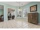 Bright breakfast nook features tile flooring, two windows, and sliding glass door to the backyard at 720 Dove Haven Ln., Myrtle Beach, SC 29579