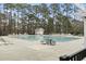 Outdoor community pool with lounge chairs and tables, perfect for relaxation and recreation at 720 Dove Haven Ln., Myrtle Beach, SC 29579