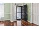 Welcoming entryway with beautiful hardwood floors and a black front door at 720 Dove Haven Ln., Myrtle Beach, SC 29579