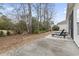 Concrete patio features lounge chairs, perfect for enjoying the natural surroundings of the backyard at 720 Dove Haven Ln., Myrtle Beach, SC 29579