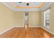 Bedroom with hardwood floors and access to hallway at 7403 Haddington Pl., Sunset Beach, NC 28468