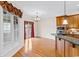 Bright dining room with hardwood floors and access to a private balcony at 7403 Haddington Pl., Sunset Beach, NC 28468