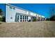 Exterior view of condo buildings with screened in porch and large grassy area at 764 Wilshire Ln. # 764, Murrells Inlet, SC 29576