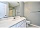 Bathroom features a white vanity, commode, and glass-enclosed shower with towel bars at 764 Wilshire Ln. # 764, Murrells Inlet, SC 29576