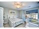 Bright bedroom with a comfortable bed and birdcages at 764 Wilshire Ln. # 764, Murrells Inlet, SC 29576