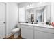 Bathroom featuring dual sinks, modern fixtures, and white cabinetry at 1052 Kinness Dr., Conway, SC 29527