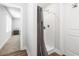 Bathroom featuring a shower with a curtain, neutral carpet, and white wooden door at 1052 Kinness Dr., Conway, SC 29527