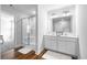 Modern bathroom featuring a glass shower, double sink vanity, and wood-look flooring at 1052 Kinness Dr., Conway, SC 29527