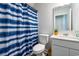 Bathroom featuring a blue striped shower curtain, toilet, and vanity with white countertop at 1052 Kinness Dr., Conway, SC 29527