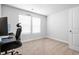 Bright bedroom with a computer desk, chair, and a window with blinds providing natural light at 1052 Kinness Dr., Conway, SC 29527