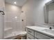 A bathroom featuring a shower and white vanity with ample storage space at 106 Riverwatch Dr., Conway, SC 29527