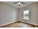 Cozy bedroom featuring a ceiling fan, and a large window with exterior views at 106 Riverwatch Dr., Conway, SC 29527