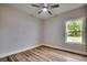 Bright bedroom featuring hardwood flooring, a ceiling fan, and natural light at 106 Riverwatch Dr., Conway, SC 29527