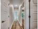 Hallway featuring hardwood flooring and white doors at 106 Riverwatch Dr., Conway, SC 29527