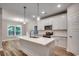 Beautiful kitchen with white cabinets, stainless steel appliances, an island, and pendant lighting at 106 Riverwatch Dr., Conway, SC 29527