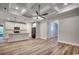 Living area showcasing coffered ceilings and hardwood floors connecting to the modern kitchen at 106 Riverwatch Dr., Conway, SC 29527