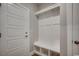 Stylish mudroom with white storage bench and coat rack at 106 Riverwatch Dr., Conway, SC 29527