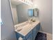 Bathroom featuring a wide mirror over a blue vanity with marble countertop at 1061 Pinwheel Loop # 1061, Myrtle Beach, SC 29577