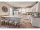 Well-lit kitchen with modern white appliances, granite countertops, and barstool seating at 1061 Pinwheel Loop # 1061, Myrtle Beach, SC 29577