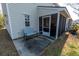 Patio outside of sunroom features a bench with an exterior view of the sunroom at 1061 Pinwheel Loop # 1061, Myrtle Beach, SC 29577