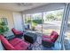 Comfortable sun room with wicker seating and a ceiling fan overlooking the back yard at 1061 Pinwheel Loop # 1061, Myrtle Beach, SC 29577