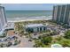 Aerial view of resort with pool, beach, parking and Black Drum restaurant at 108 Rothbury Circle # 207, Myrtle Beach, SC 29572