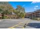 Exterior view of a two-story building with parking lot at 108 Rothbury Circle # 207, Myrtle Beach, SC 29572