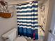 Bathtub and shower combination with blue and white curtains at 109 Westhill Circle # 3-C, Myrtle Beach, SC 29572