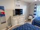 Nautical-themed bedroom with two beds, a modern TV, and serene atmosphere at 109 Westhill Circle # 3-C, Myrtle Beach, SC 29572