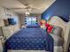 Nautical-themed bedroom with two beds, ceiling fan, and a modern TV at 109 Westhill Circle # 3-C, Myrtle Beach, SC 29572