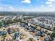 A beautiful aerial view of a residential neighborhood showcases the home's location and surrounding landscape at 116 Cypress Estates Dr., Murrells Inlet, SC 29576