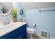 Cozy bathroom featuring a blue vanity, decorative accents, and charming nautical themed decor at 116 Cypress Estates Dr., Murrells Inlet, SC 29576