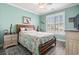 Cozy bedroom featuring wood-look floors, a ceiling fan, and large windows with plantation shutters at 116 Cypress Estates Dr., Murrells Inlet, SC 29576