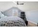 Comfortable bedroom with a window view, ceiling fan, and a patterned quilt on the bed at 116 Cypress Estates Dr., Murrells Inlet, SC 29576