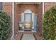 Inviting front entrance with a decorative glass door, sidelights, and stylish landscaping at 116 Cypress Estates Dr., Murrells Inlet, SC 29576